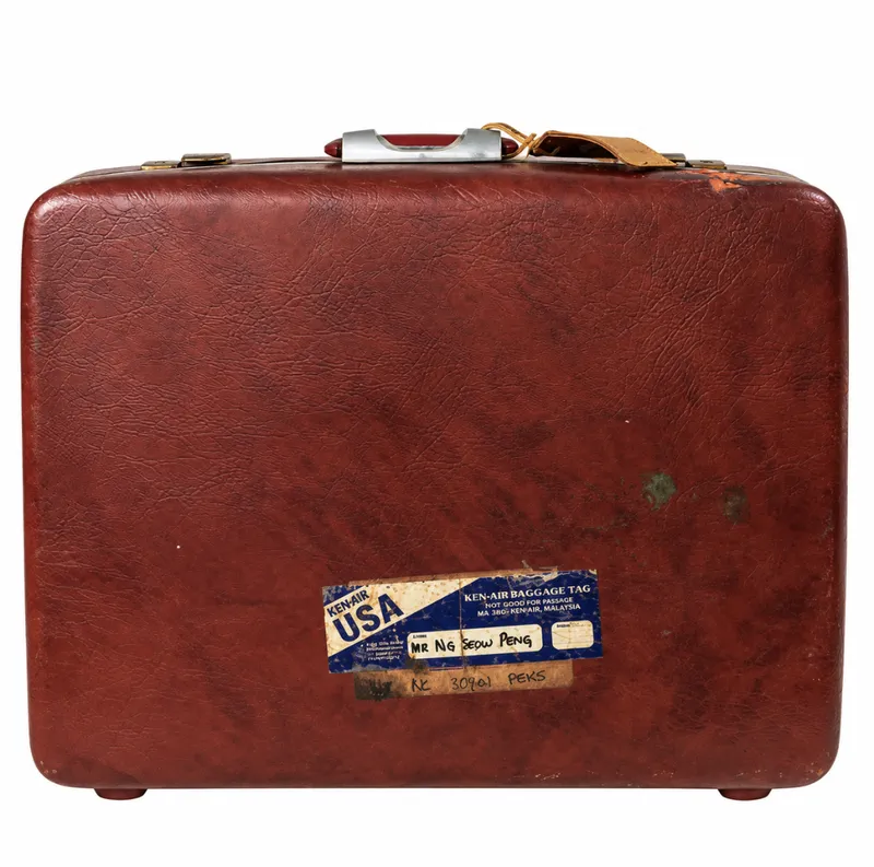 Vintage Burgundy hard-shell suitcase